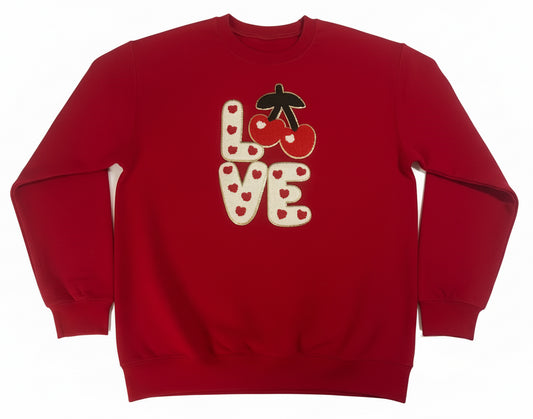 Red sweatshirt with 'LOVE' and cherry design on a white background
